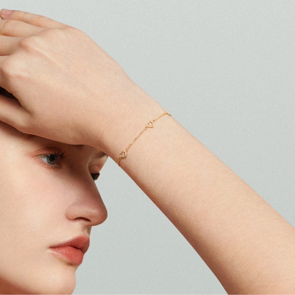 glow-204-0236-19-schakelarmband-glanzend-goud-open-hartjes-6-mm-hoog-lengte-19-cm