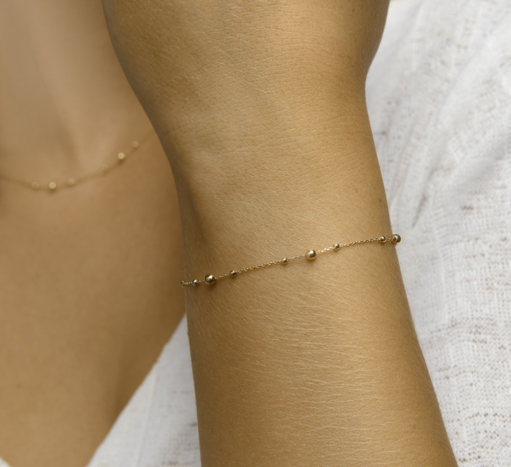 14-karaat-geelgouden-schakelarmband-met-bolletjespatroon