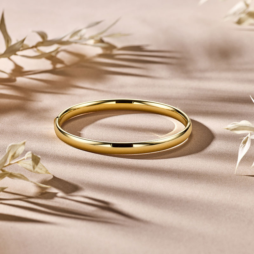 ovale-14-karaat-gouden-slavenarmband-met-glanzende-afwerking-6-mm-breed-diameter-60-mm