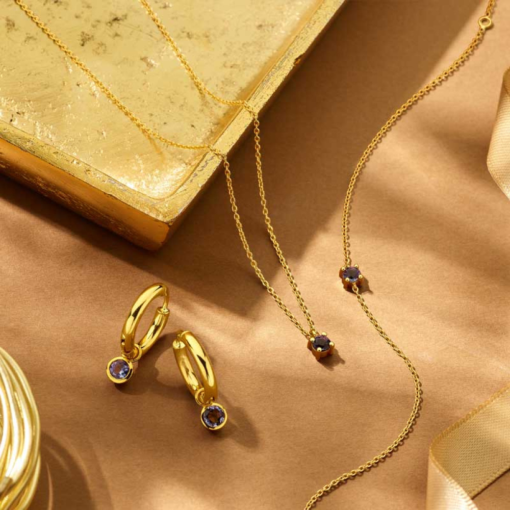 14-karaat-gouden-armband-met-groene-geboortesteen-en-verstelbare-ankerschakel