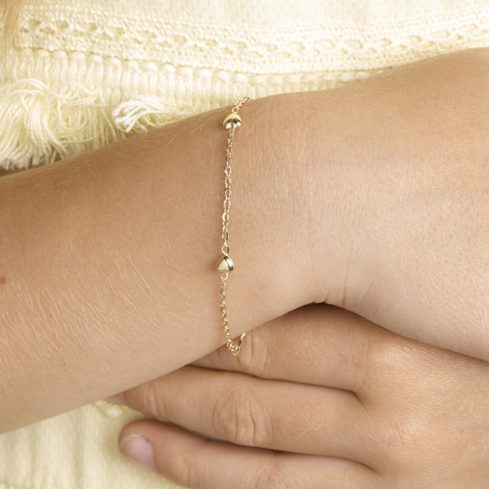 14-karaat-gouden-kinderarmband-met-hartjes-en-ankerschakel