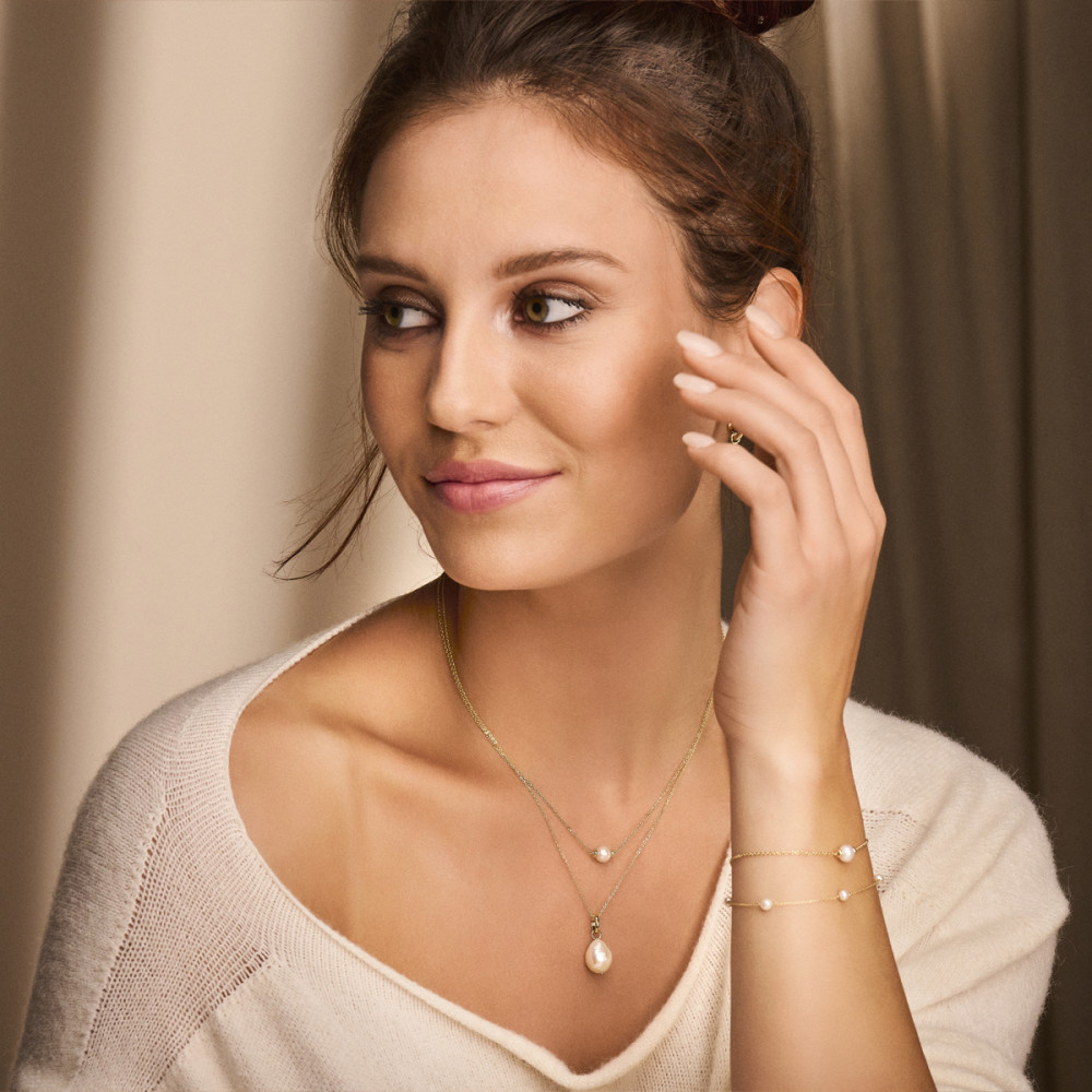 14-karaat-gouden-parelarmband-met-zoetwaterparels-en-ankerpatroon