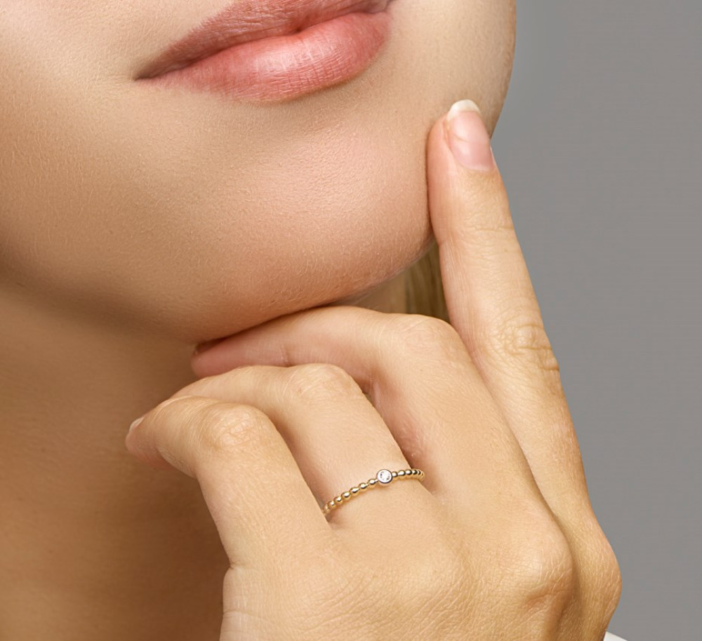 gouden-bolletjesring-met-centrale-zirkonia