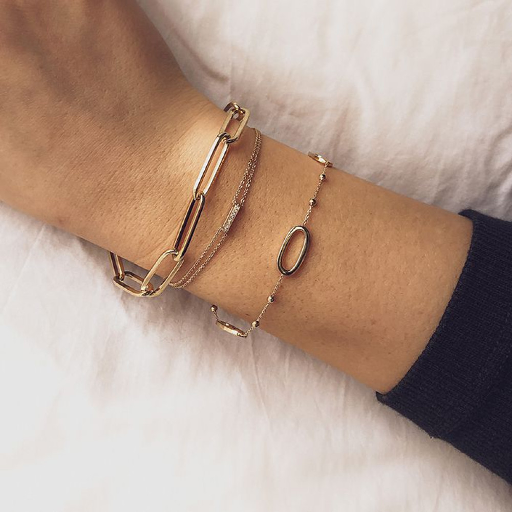 gouden-schakelarmband-met-dubbele-ketting-en-diamanten