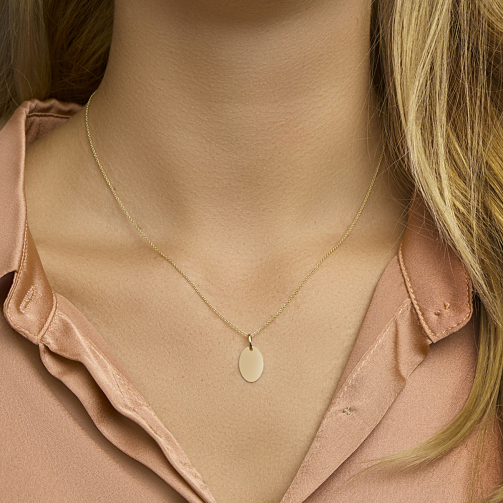 ovaal-graveerplaatje-van-14-karaat-goud-10-mm-breed-hoogte-15-mm