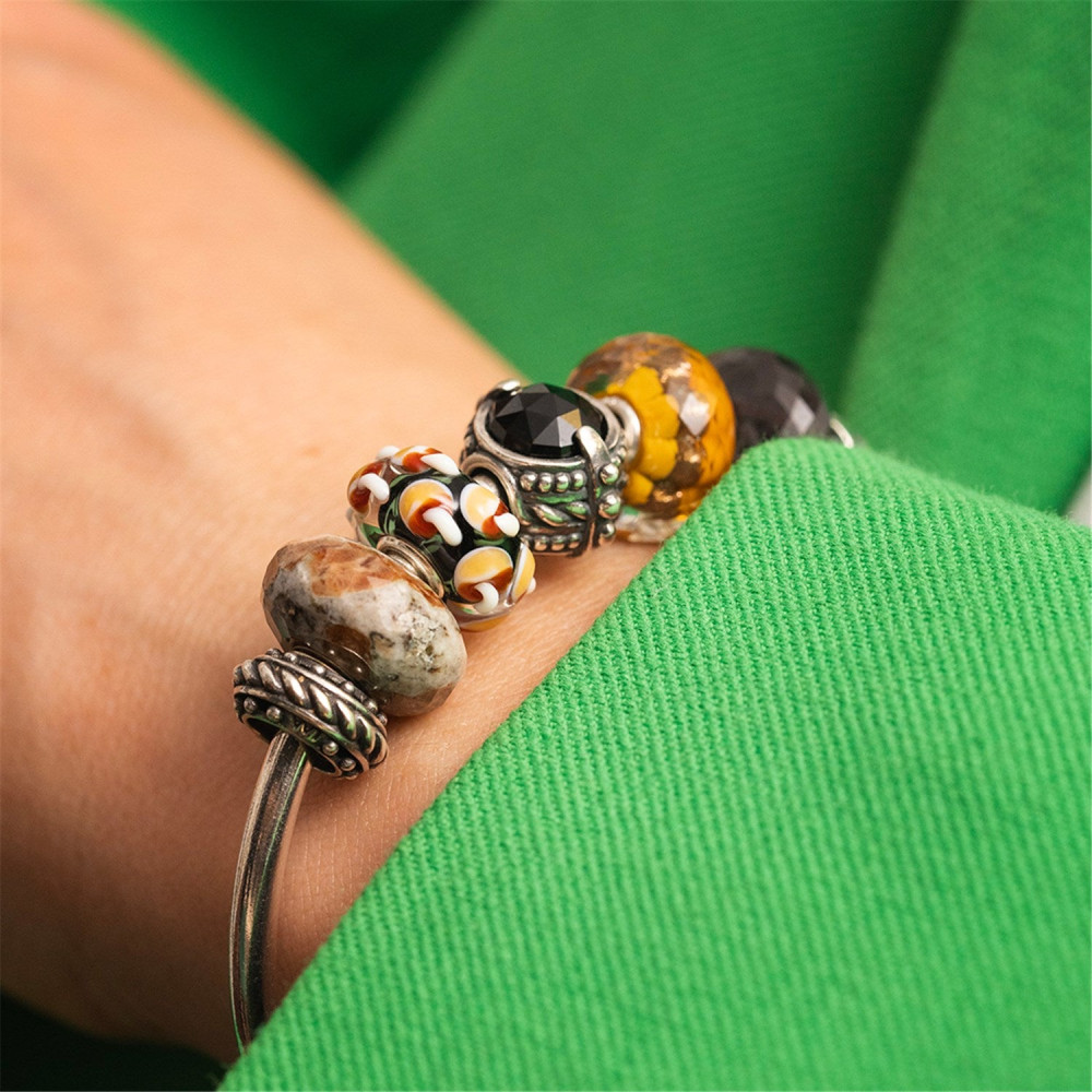 trollbeads-tglbe-20424-glazen-bedel-met-abstracte-bloemen-en-bladeren-in-zwart-groen-oranje-en-wit