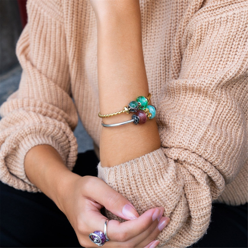 trollbeads-tgpba-00006-000010-goudkleurige-gedraaide-bangle-met-open-uiteinden