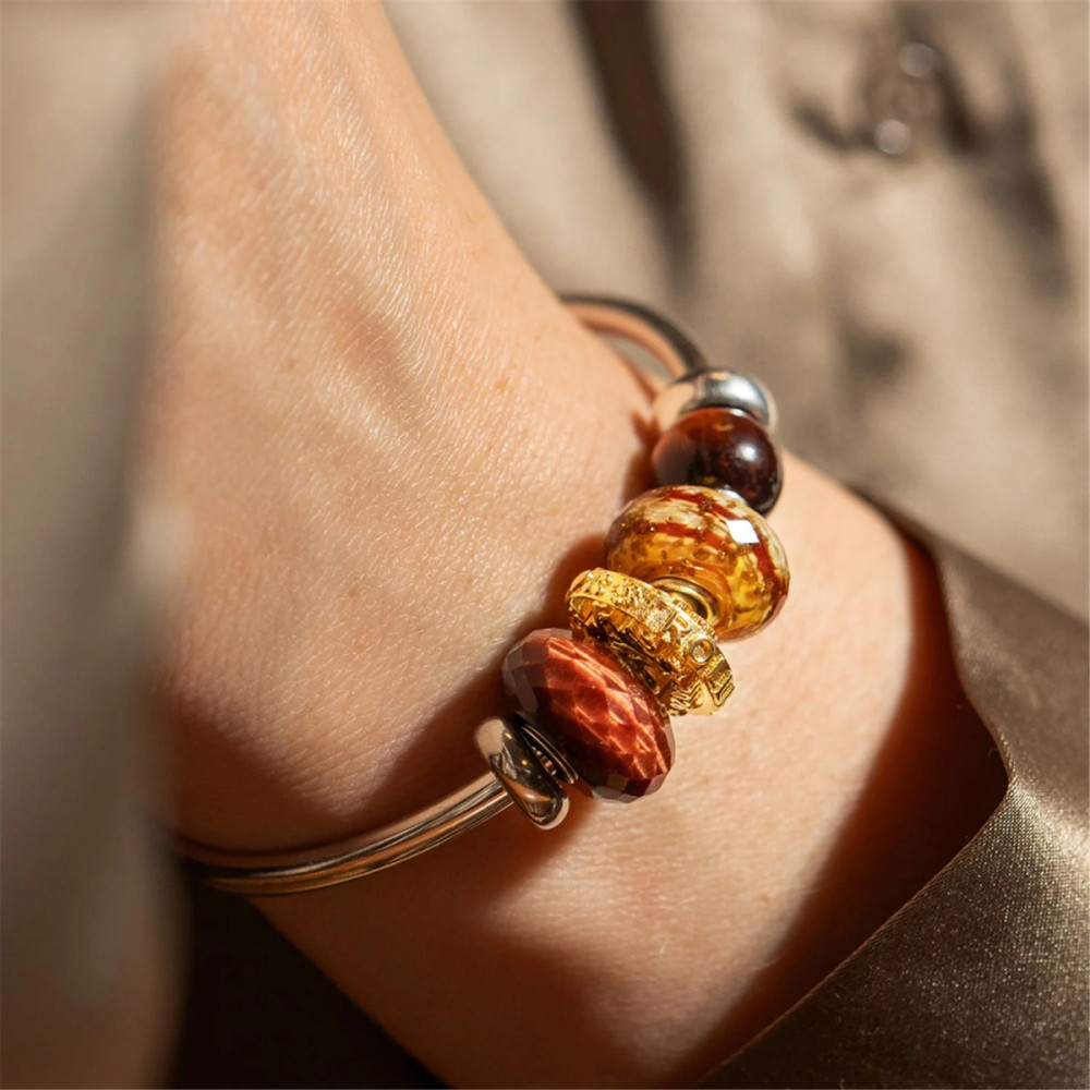 trollbeads-tgpbe-80001-jubileum-bedel-goudkleurig-met-jaartallen-en-logo